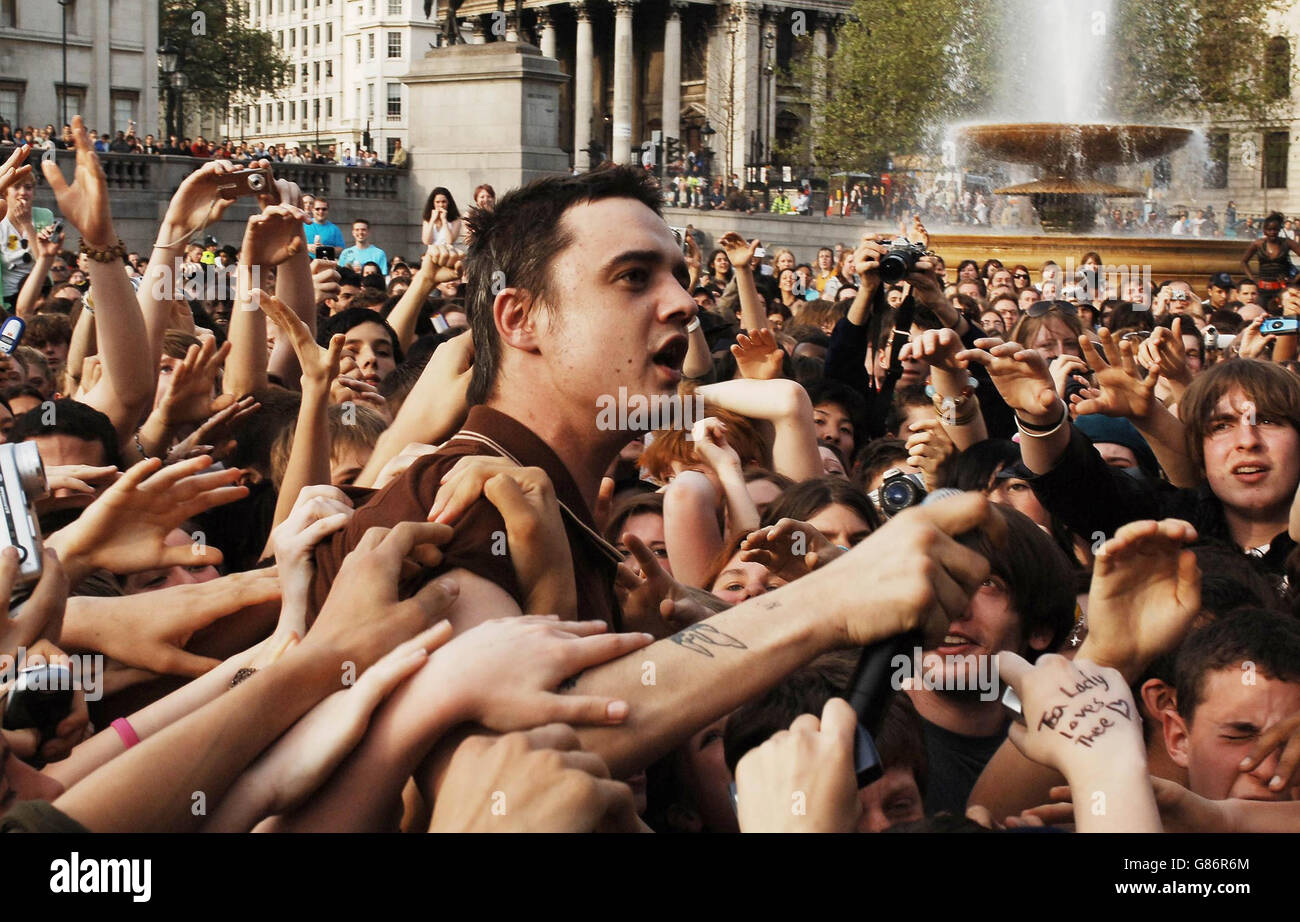 Troubled rock star Pete Doherty is mobbed by fans after jumping into the crowd of May Day marchers in Trafalgar Square, where he performed to drive home an anti-racist message of unity ahead of Thursday's general election. Stock Photo