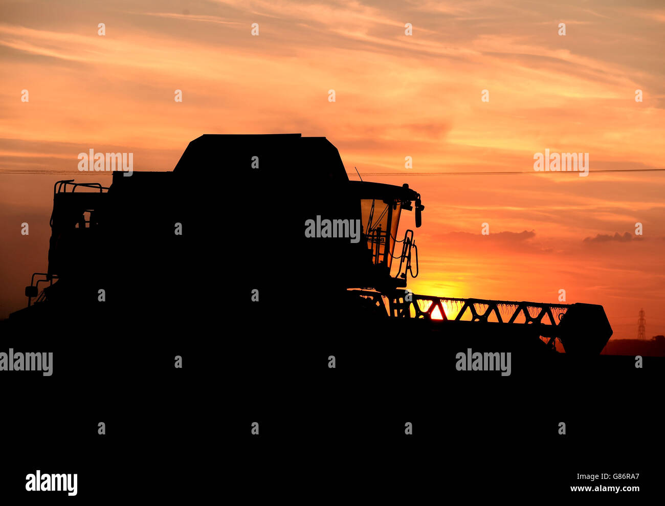 Harvest 2015, Cambridgeshire. A combine harvester in a field in Cambridgeshire. Stock Photo