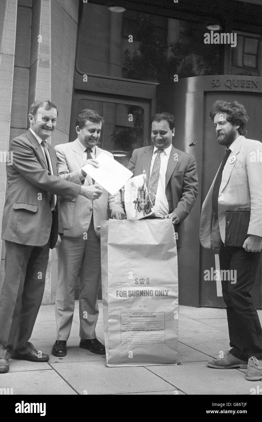 Labour MPs outside the Home Office in London, burning their invitations to tonight's party to celebrate the Royal Assent being given to what they call the 'racist and shameful' Immigration Act. (l-r) Pat Wall, Max Madden, Keith Vaz and Jeremy Corbyn. Stock Photo