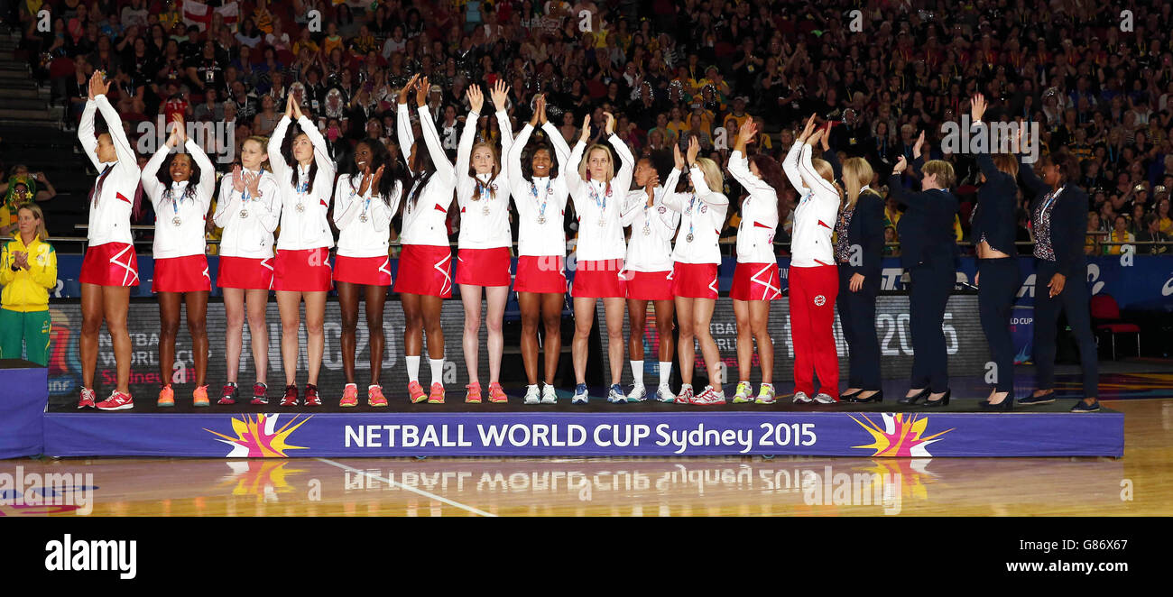 The England team celebrate with their Bronze medals at the end of the