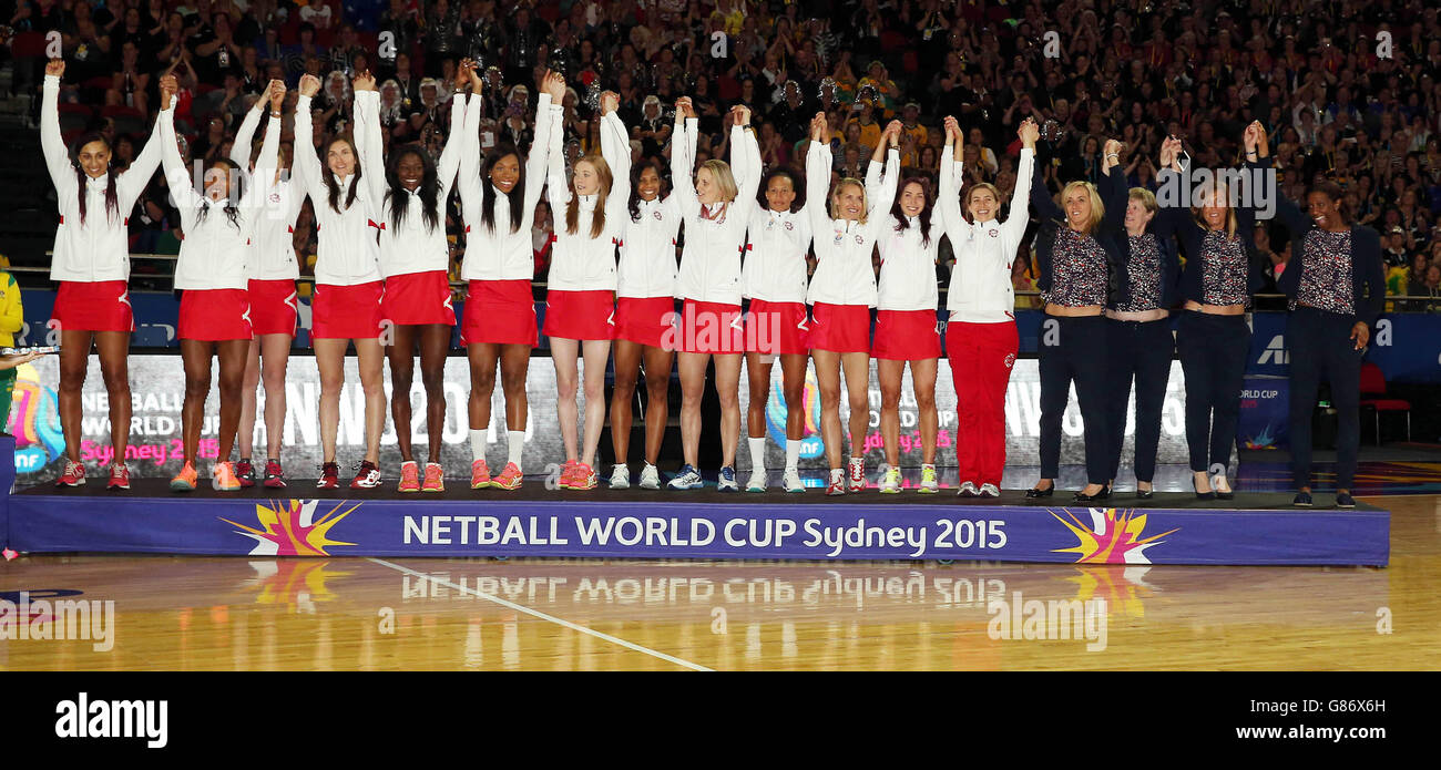The England team celebrate with their Bronze medals at the end of the