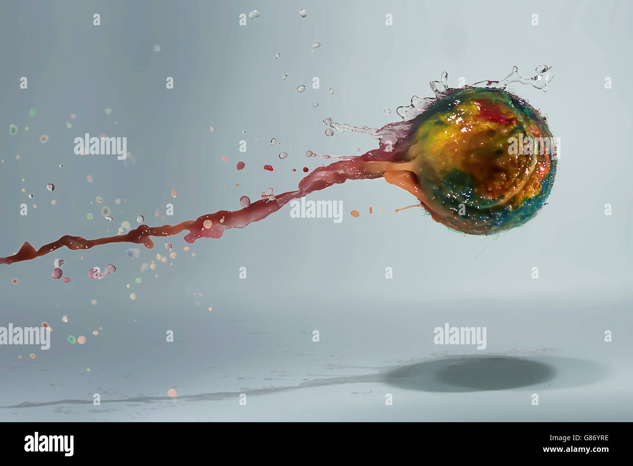 Wet Tennis ball covered in acrylic paint mid air Stock Photo Alamy