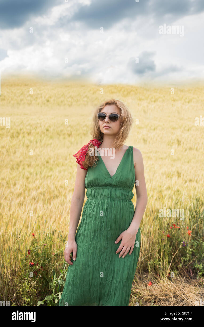 Woman standing in wheat field Stock Photo - Alamy