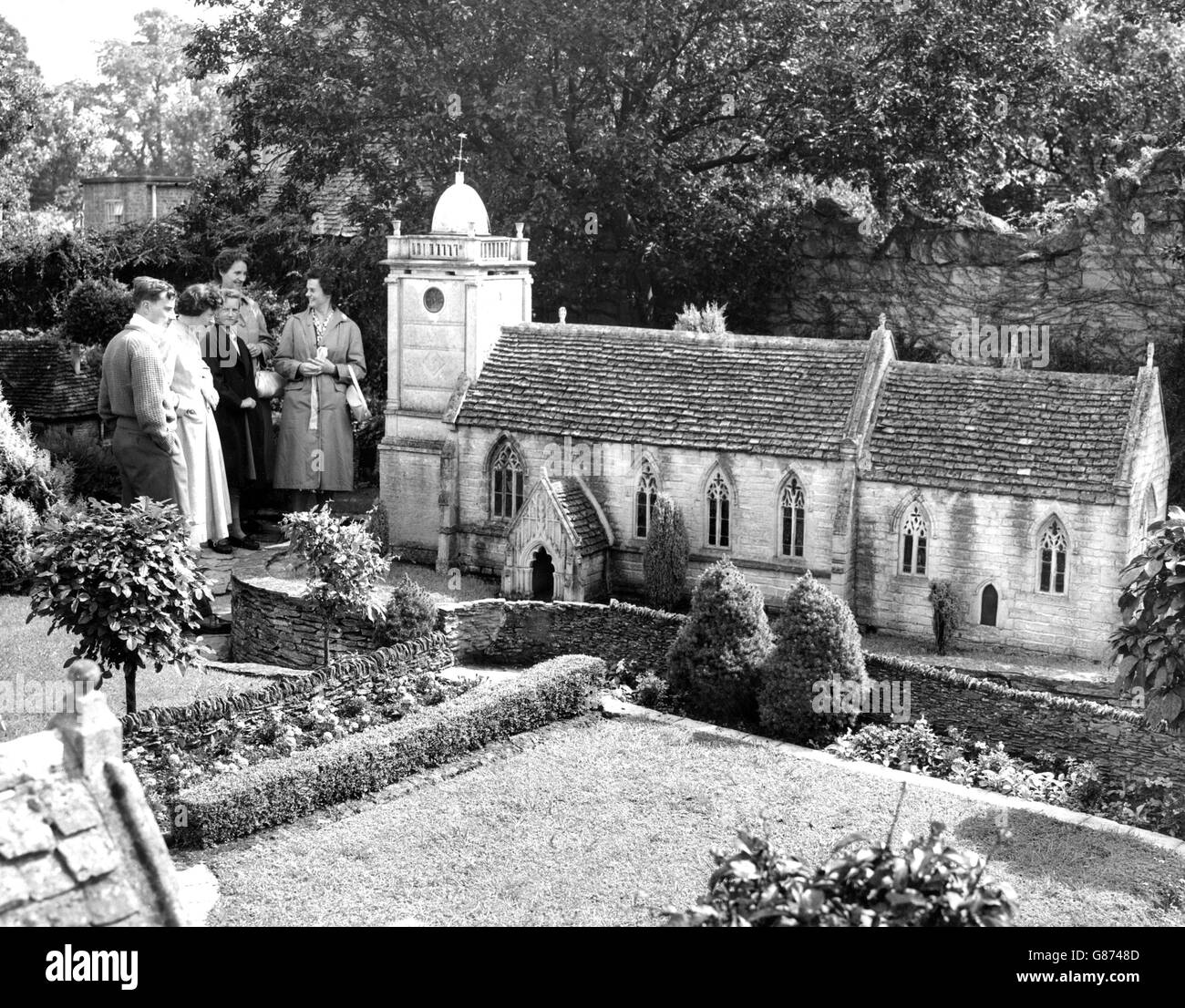 A one-ninth scale model of the parish church at Bourton-on-the-Water, which forms part of the model village in the Cotswold beauty spot. Stock Photo