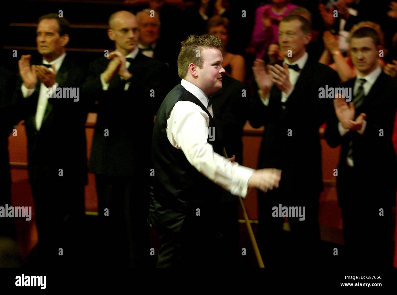 Shaun Murphy walks past former world snooker champions as he enters the