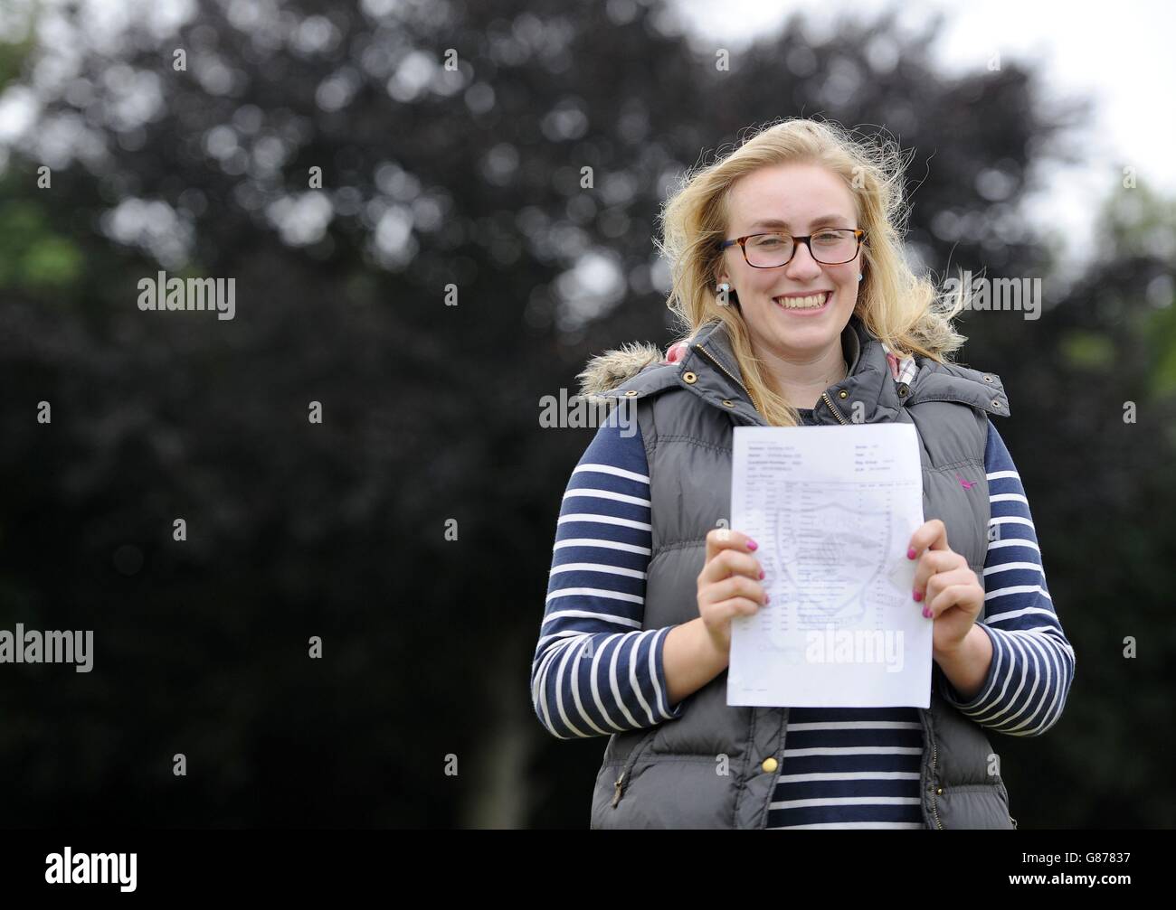 Student Victoria Lee, 18, who will go to Surrey University to study Veterinary Medicine, holds her A-level results at Chelmsford County High School for Girls. Stock Photo