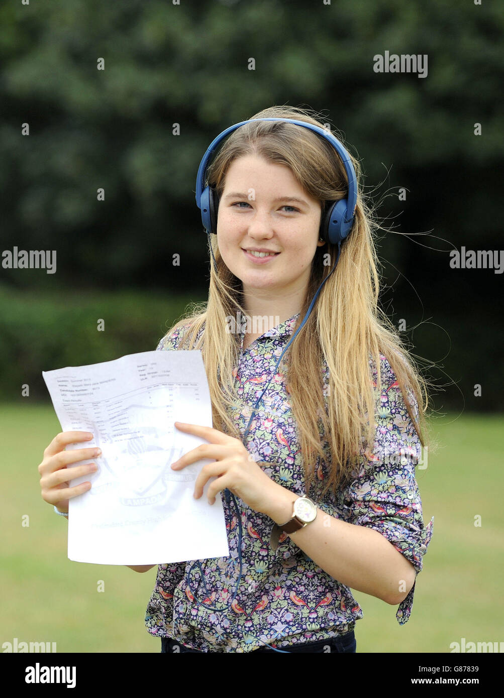 Student Elspeth Sanders, 18, who will go to Oxford University to study music, holds her A-level results at Chelmsford County High School for Girls. Stock Photo