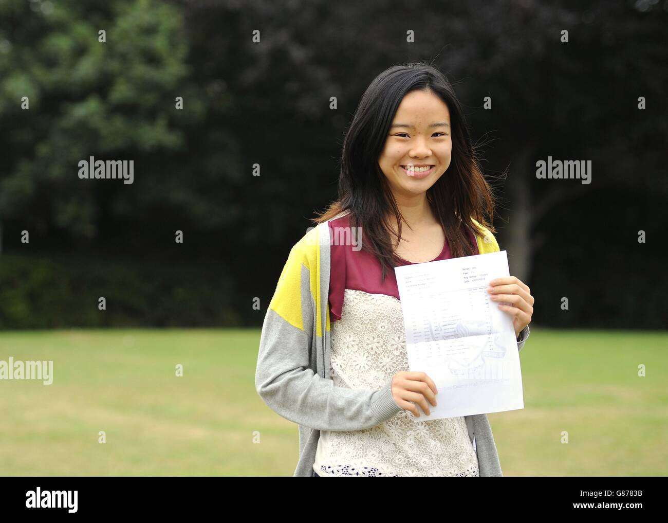Student Tiffany Hui, 18, who achieved 4 A*'s and 1 A and will go to Cambridge university to study Law, holds her A-level results at Chelmsford County High School for Girls. Stock Photo