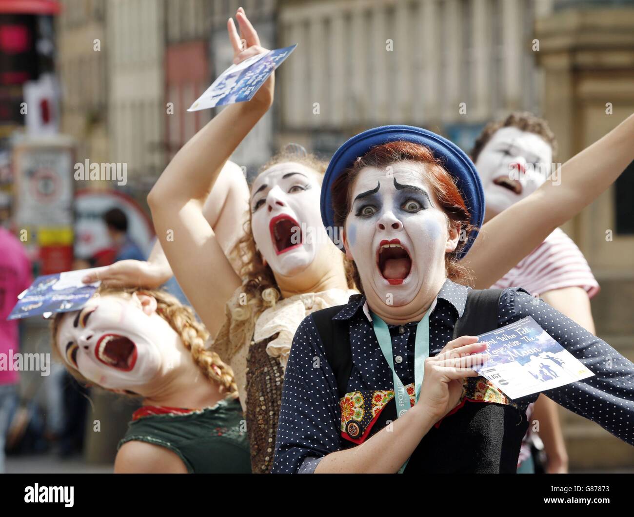 STANDALONE Photo. Performers promote Edinburgh Festival Fringe show The Girl Who Fell In Love With The Moon on the Royal Mile in Edinburgh. Stock Photo