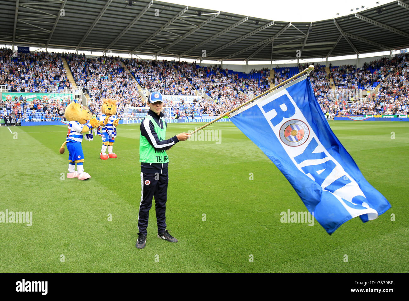 Reading flag bearer waves a flag on the pitch before kick off Stock