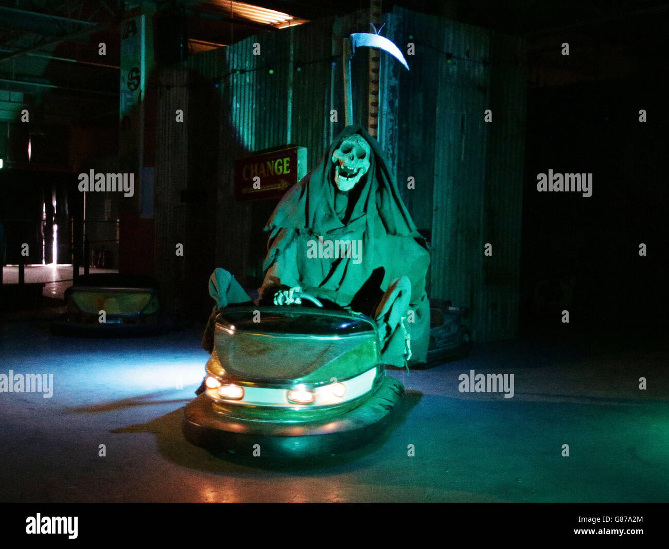 The grim reaper rides the dodgems at Dismaland - Bemusement Park, Banksy's biggest show to date, in Weston-super-Mare, Somerset. Stock Photo