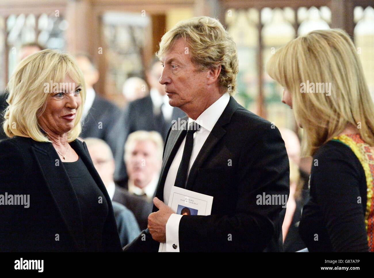 FREE UNTIL AUGUST 27, 2015. AFTER THIS TIME A FEE IS PAYABLE Nigel Lythgoe and wife Bonnie (left) at the funeral of Cilla Black at St Mary's Church in Woolton, Liverpool. Stock Photo