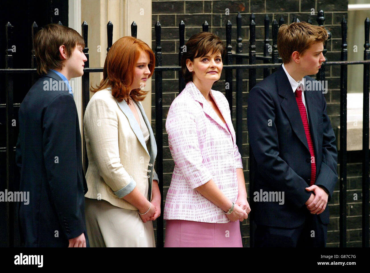 Cherie Blair and her children, Nicky (left), Kathryn and Euan listen as Prime Minister Tony Blair holds a press conference in Downing Street. Stock Photo