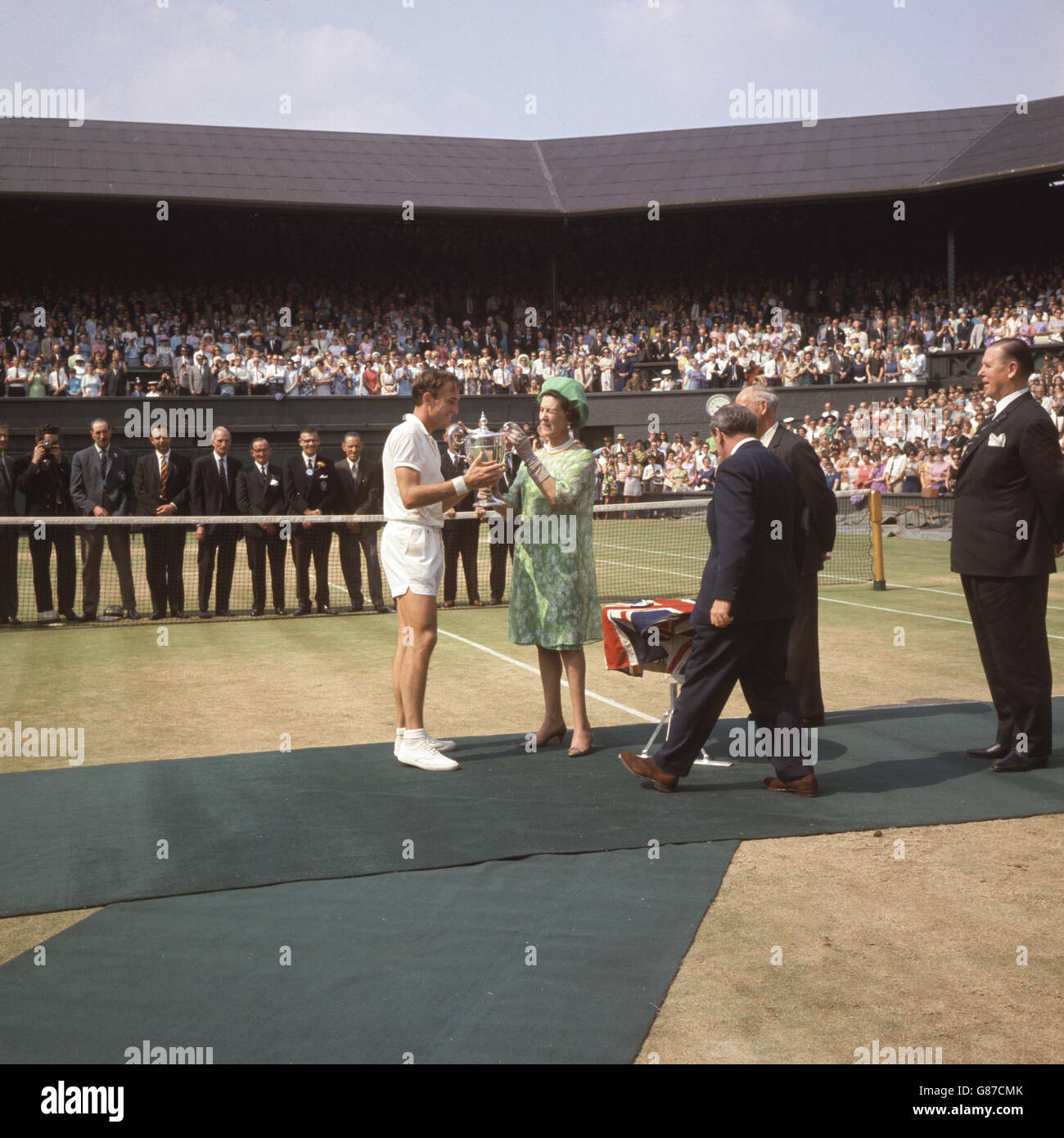 Australian John Newcombe receives the trophy off Princess Marina after beating Germany's Wilhelm Bungert in the final. Stock Photo