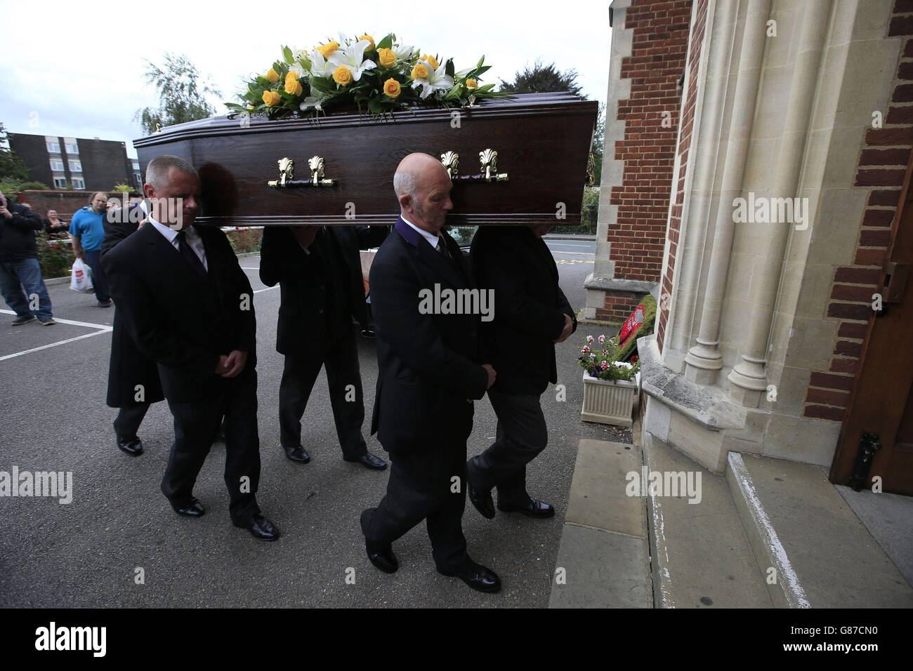 The coffin of actor Stephen Lewis, known for his role as Inspector Cyril 'Blakey' Blake in sitcom On The Buses, is carried into Our Lady of Lourdes church in Wanstead, east London, for his funeral service. Stock Photo