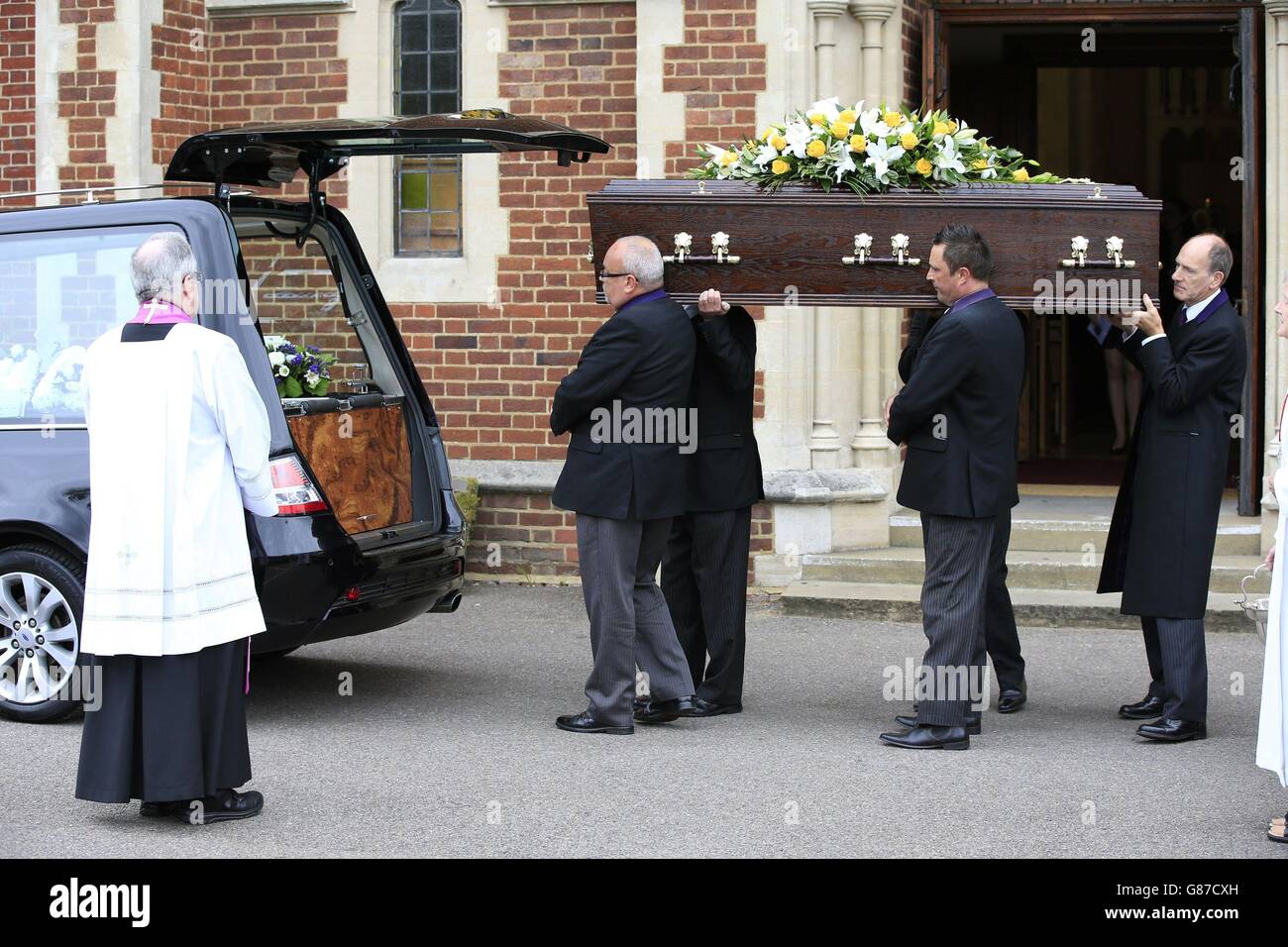 The coffin of actor Stephen Lewis, known for his role as Inspector Cyril 'Blakey' Blake in sitcom On The Buses, is carried out of Our Lady of Lourdes church in Wanstead, east London, following his funeral service. Stock Photo