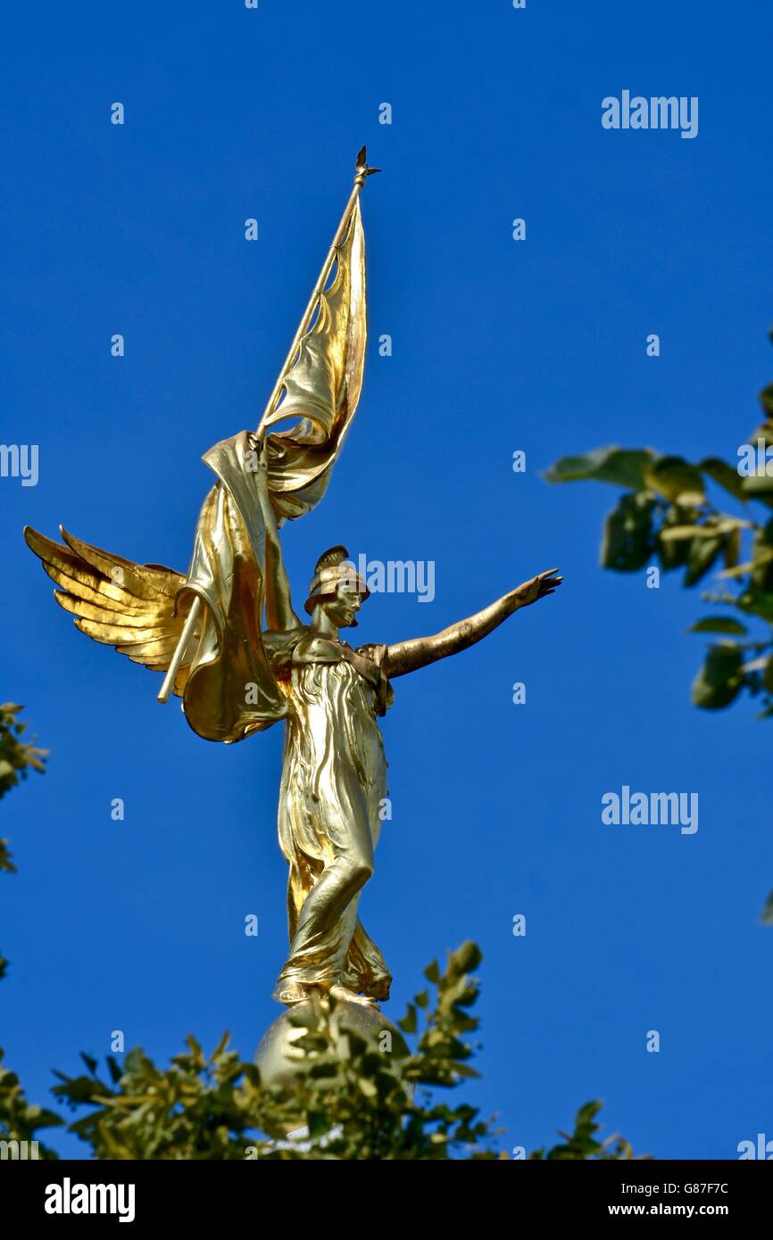 A beautiful gold statue on top of a memorial in DC Stock Photo Alamy