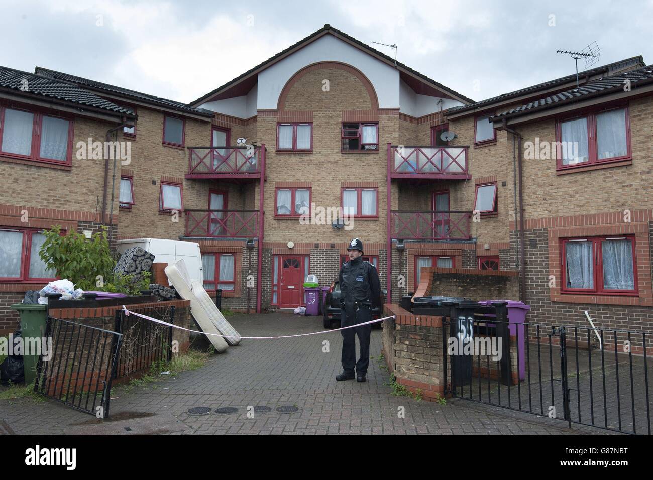 A policeman in Huddleston Close in Tower Hamlets, in London, after a