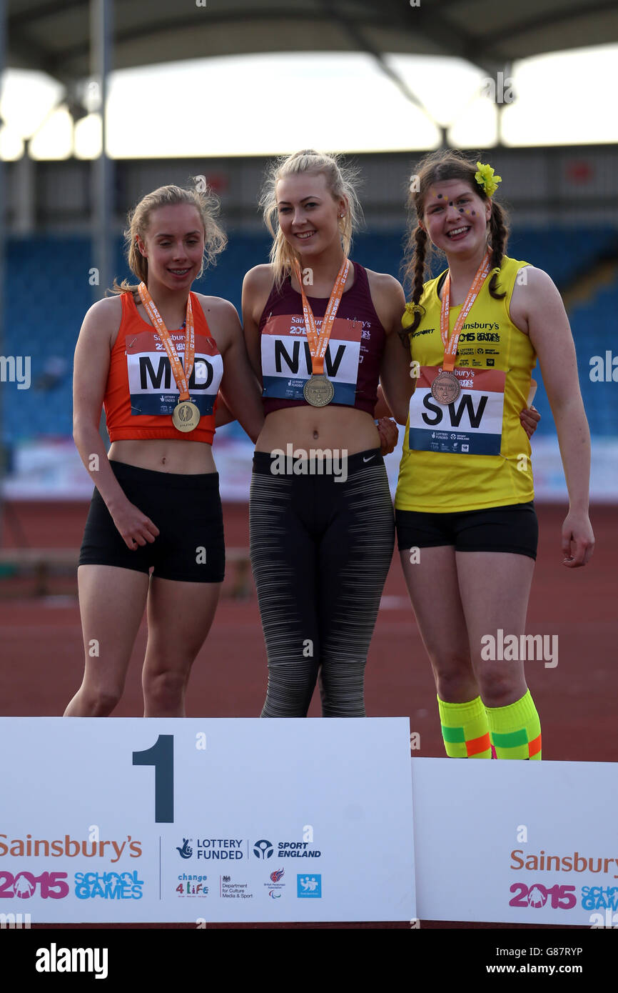 (l-r) England Midlands' Megan Richter, England North West's Erin McBride and England South West's Kelly Hutchins receive their girls ambulant 400 metre medals during the medal ceremony at the Sainsbury's 2015 School Games at the Manchester Regional Arena. Stock Photo