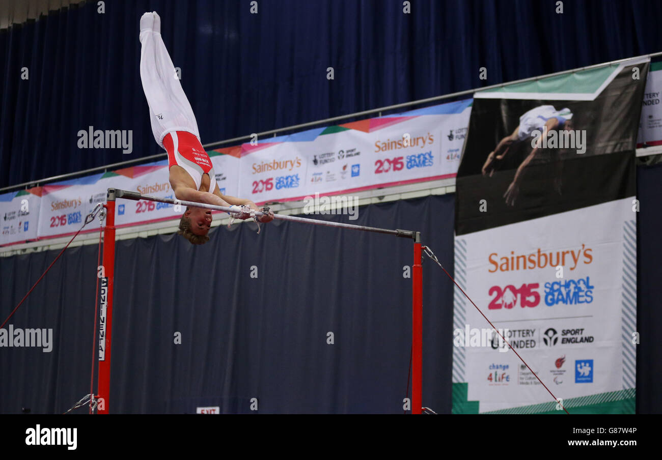 Wales Benjamin Eyre on the Horizontal Bar in the Gymnastic during the Sainsbury's 2015 School Games in Manchester. Stock Photo