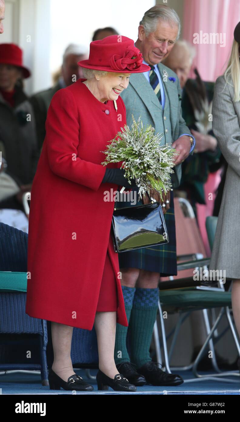 The Games' patron Queen Elizabeth II and the Prince of Wales, known as the Duke of Rothesay when in Scotland during the Braemar Royal Highland Gathering held a short distance from the royals' summer retreat at the Balmoral estate in Aberdeenshire. Stock Photo