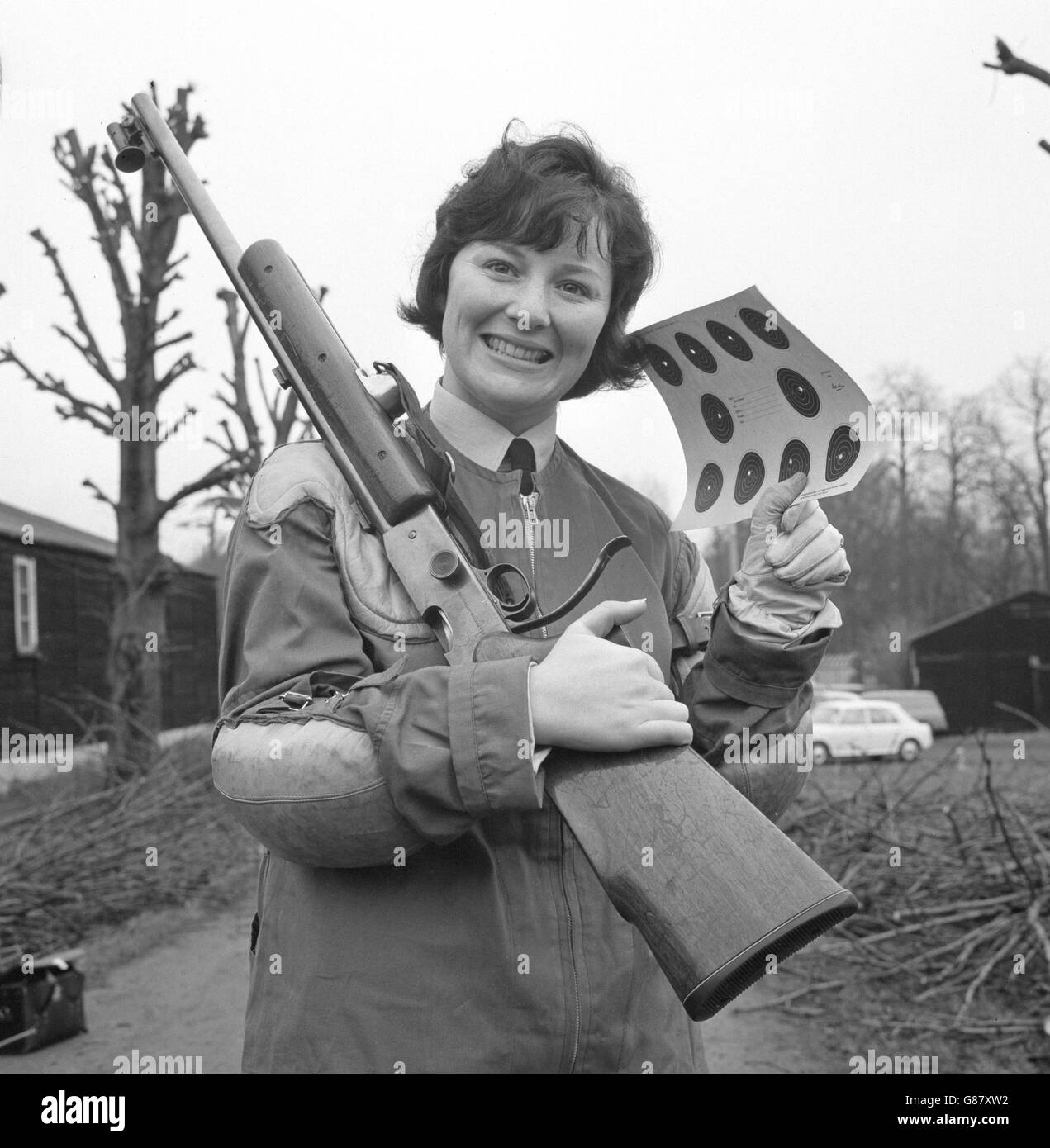 Pilot Officer Linda McGowan of Liverpool holds up a target card on the rifle range at RAF Uxbridge, Middlesex. She is one of the 16 top shots of the Women's Royal Air Force, from whom a team of ten will be chosen for an attempt to regain the Women's Inter-Services Small-bore Rifle Championship. Stock Photo