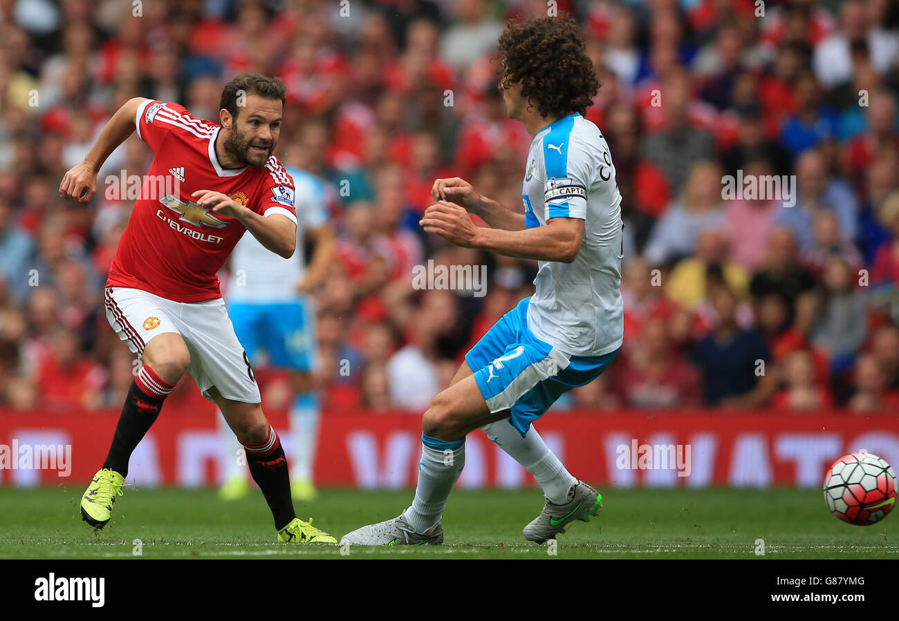 Soccer - Barclays Premier League - Manchester United v Newcastle United - Old Trafford. Manchester United's Juan Mata beats Newcastle United's Fabricio Coloccini Stock Photo