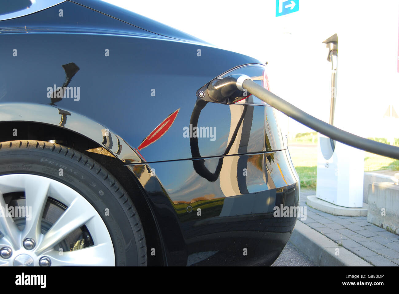 E-car being charged at a charging station Stock Photo - Alamy