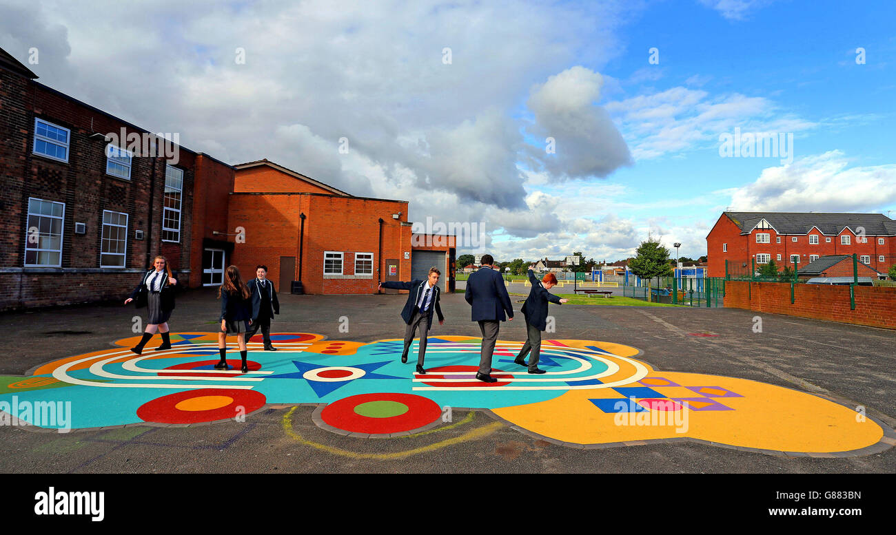 Children from Childwall Sports and Science Academy, Liverpool, play on the newly installed Peter Blake inspired Dazzle playground on their first day back at school. Stock Photo