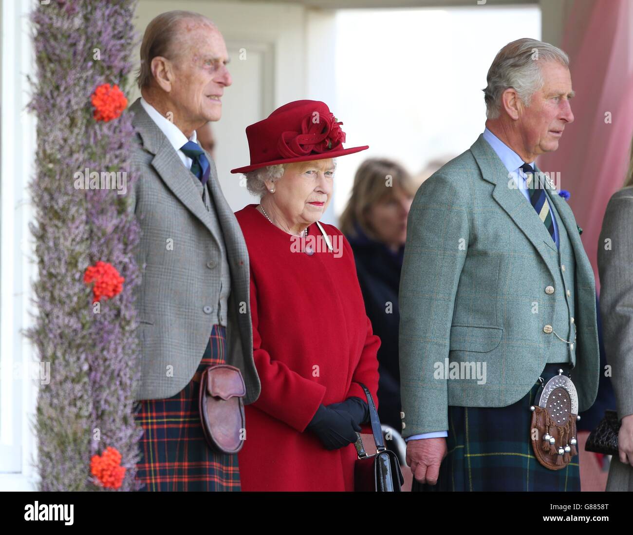 The Duke of Edinburgh, The Games' patron Queen Elizabeth II and the Prince of Wales, known as the Duke of Rothesay when in Scotland during the Braemar Royal Highland Gathering held a short distance from the royals' summer retreat at the Balmoral estate in Aberdeenshire. Stock Photo