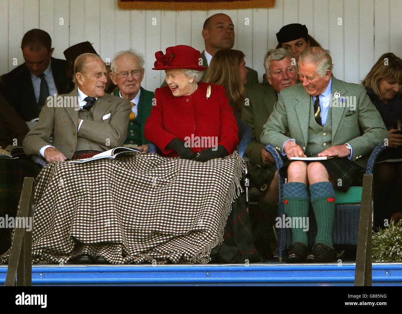 The Duke of Edinburgh, The Games' patron Queen Elizabeth II and the Prince of Wales, known as the Duke of Rothesay when in Scotland during the Braemar Royal Highland Gathering held a short distance from the royals' summer retreat at the Balmoral estate in Aberdeenshire. Stock Photo