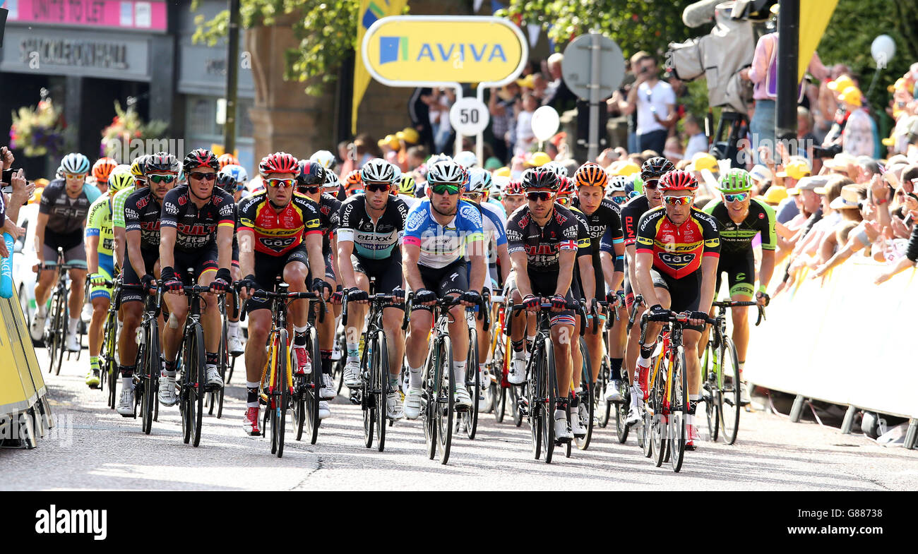 Etixx-Quick Step's Mark Cavendish (centre) and the trailing pack cross the finish line in Colne town centre, during Stage Two of the Tour of Britain from Clitheroe to Colne. PRESS ASSOCIATION Photo. Picture date: Monday September 7, 2015. See PA story CYCLING Tour. Photo credit should read: Peter Byrne/PA Wire Stock Photo