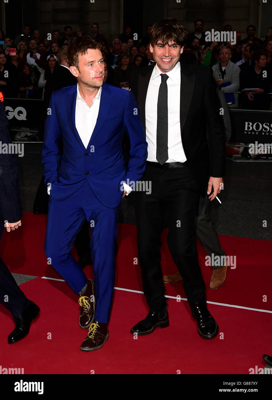 Blur's Damon Albarn and Alex James (right) attending the 2015 GQ Men of the Year Awards at the Royal Opera House, London. PRESS ASSOCIATION Photo. Picture date: Tuesday September 8, 2015. See PA story SHOWBIZ GQ. Photo credit should read: Ian West/PA Wire Stock Photo