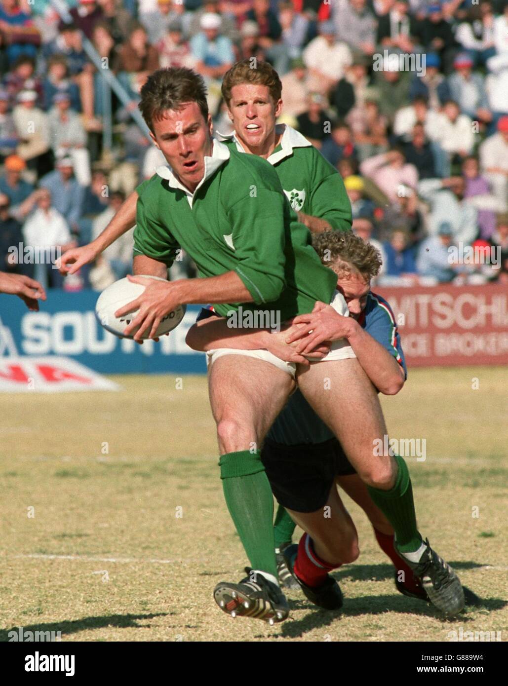 Union Rugby - 1st Test - Windhoek Rugby Stadium - Namibia v Ireland. Ireland's Jim Staples breaks away with the ball as team mate Brendan Mullin looks on Stock Photo
