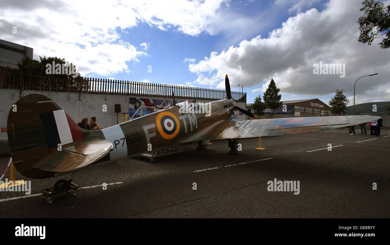 A replica Spitfire on display as an anti-racism mural entitled Band of Brothers is unveiled on a peace wall off the Shankil Road Belfast, on the 75th anniversary of the Battle of Britain to mark the valiant efforts of Polish airmen, who were stationed in Northern Ireland. Stock Photo
