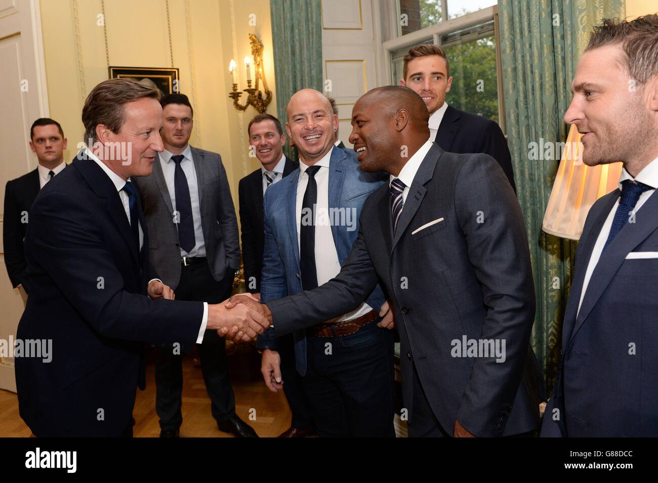 Prime Minister David Cameron (left) meets cricketers including Brian Lara (second right) at a reception at No.10 Downing Street ahead of the Help for Heroes Twenty20 cricket match taking place at the Kia Oval tomorrow. PRESS ASSOCIATION Wednesday September 16, 2015. Players from each of the teams playing in the fundraiser (England Physical Disability, H4H cricket team, and two teams made up of cricketing legends) attended the reception, including Brian Lara, Mahendra Singh Dhoni, Gary Kirsten, Andrew Strauss, and Sunny Gavaskar. Photo credit should read: Stefan Rousseau/PA Wire Stock Photo