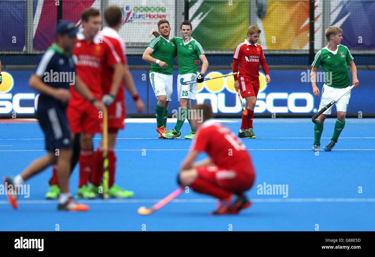 Ireland's Shane O'Donoghue (centre left) celebrates scoring his sides fourth goal with team-mate Jonathan Burton the Bronze Medal match at the Lee Valley Hockey and Tennis Centre, London. Stock Photo