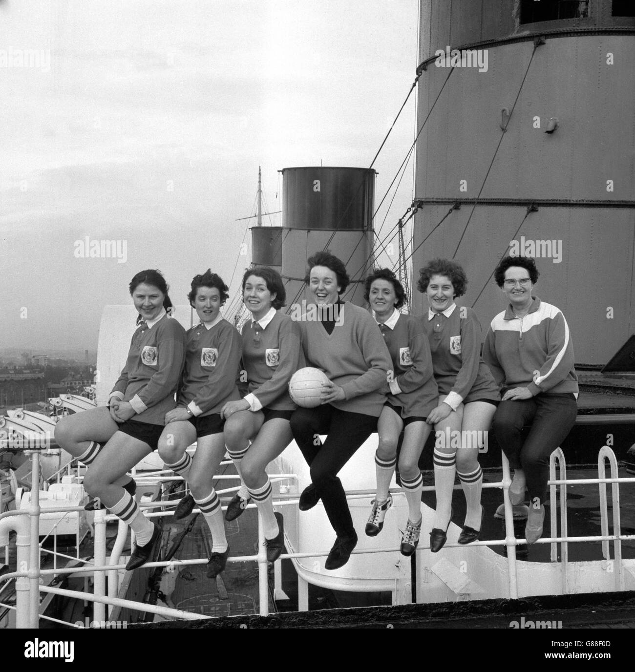 A newly-formed women's soccer team take a break from training on the sun deck of the Cunard liner Queen Mary at Southampton. The team play their first match at Southampton Sports Centre on Sunday, against Royal Exchange Insurance Ladies. (l-r) Margot Fruauf of Clifton, Helen Fitzpatrick of Southampton, Alexandra Oliver of Hampshire, Anne Rowles of Hounslow, Greta Martin of Southampton, Jennifer Ife of Castle Gresley and Marie Semple of Southampton. Stock Photo