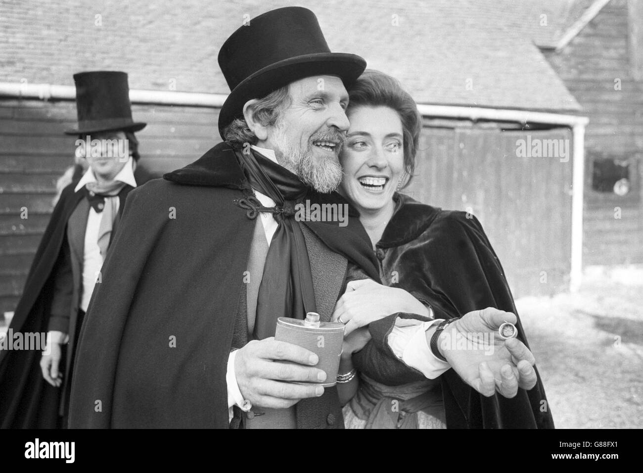 John Barnard, 43, with his 29-year-old wife Diana, at Stockers Farm in Rickmansworth, after defending her honour in a pistol duel. He settled his difference with Dr Michael Carson, 53, in the time-honoured way at 10 paces with 100-year-old pistols loaded with real power and blank wads. Mr Barnard laid down the challenge to his fellow Londoner earlier this year after accusing Dr Carson of being to affectionate with his wife. Stock Photo