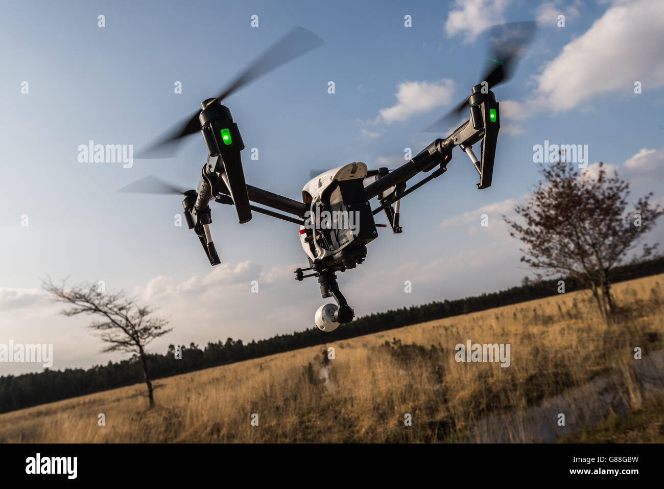 Drone camera flying mid air Stock Photo