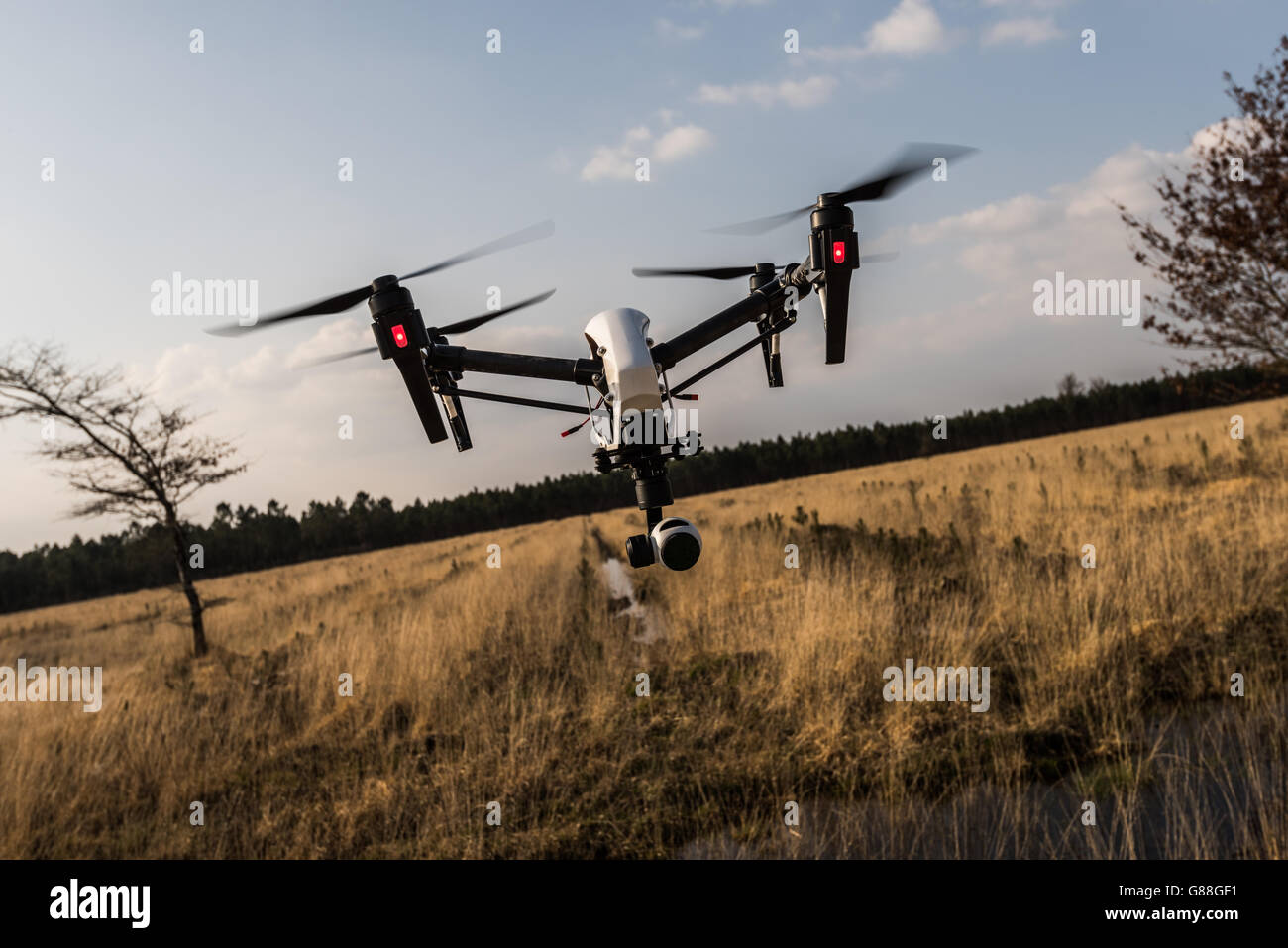 Drone camera flying mid air Stock Photo