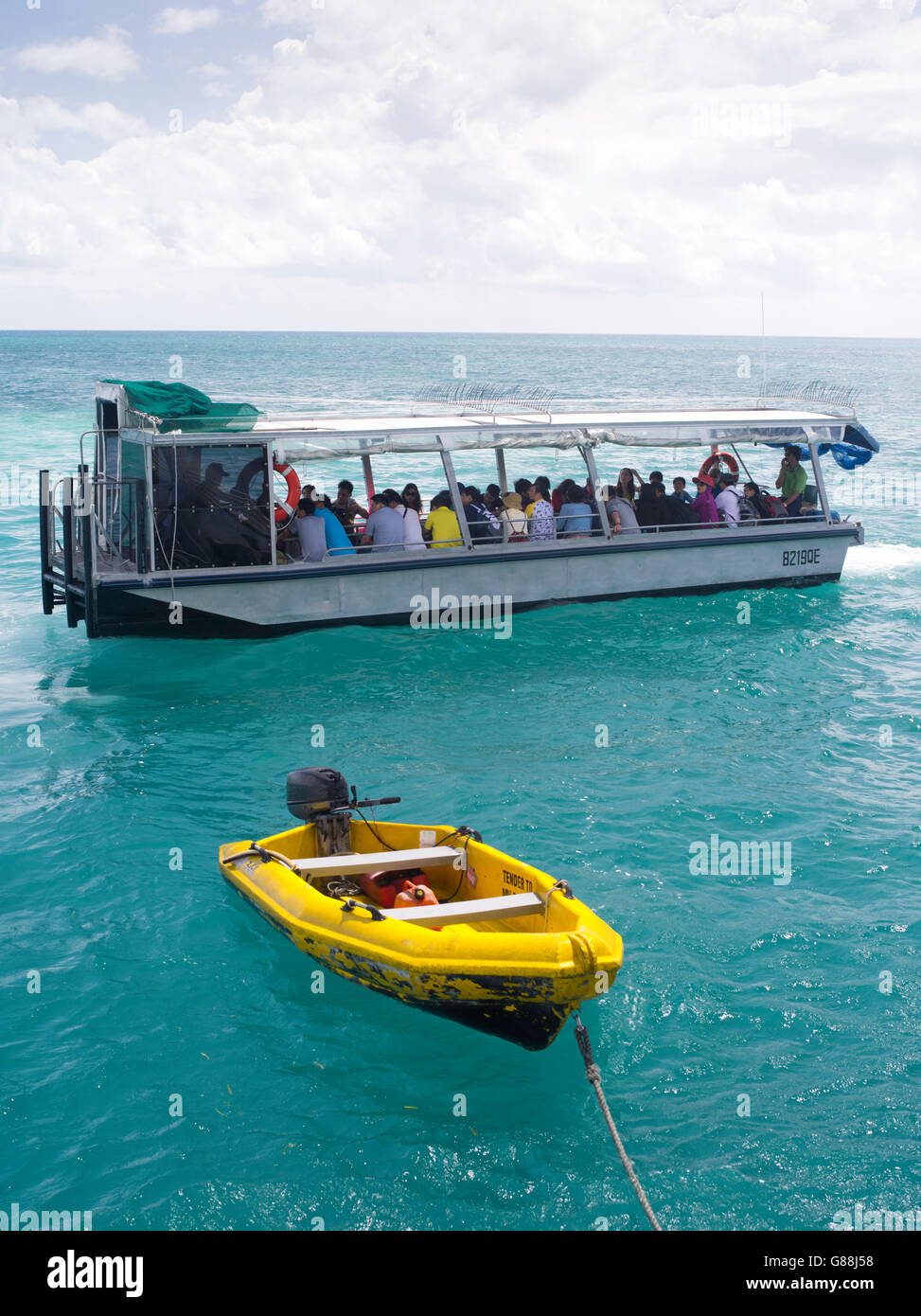 A glass bottom boat takes tourists on a reef tour at Green Island