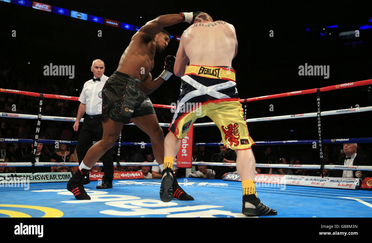 Anthony Joshua (left) on his way to a first round stoppage victory over Gary Cornish in their Commonwealth Heavyweight title bout at the O2 Arena, London. Stock Photo