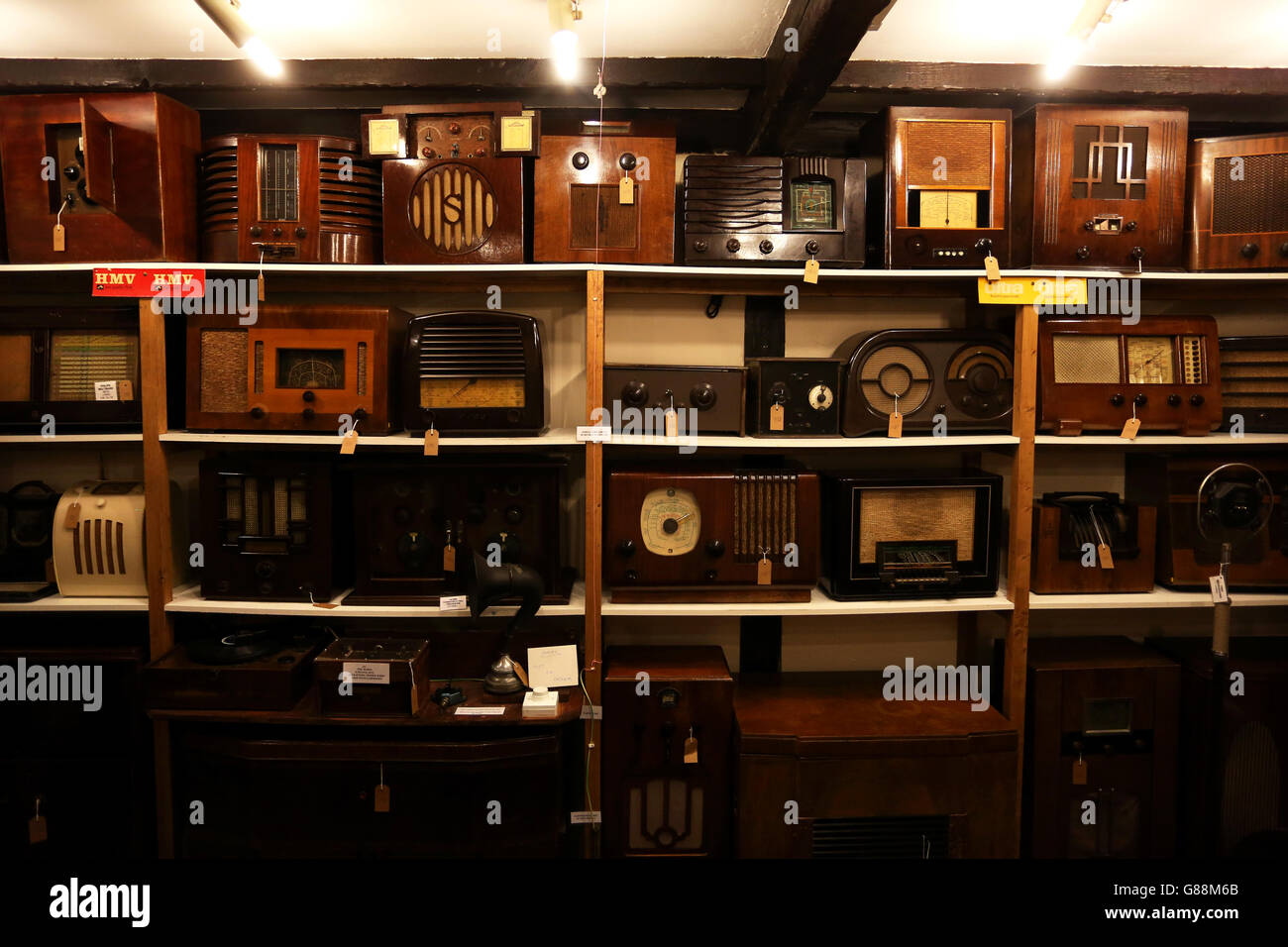 Old radios pictured stacked up inside Bognor Regis Museum, West Sussex, UK. Stock Photo