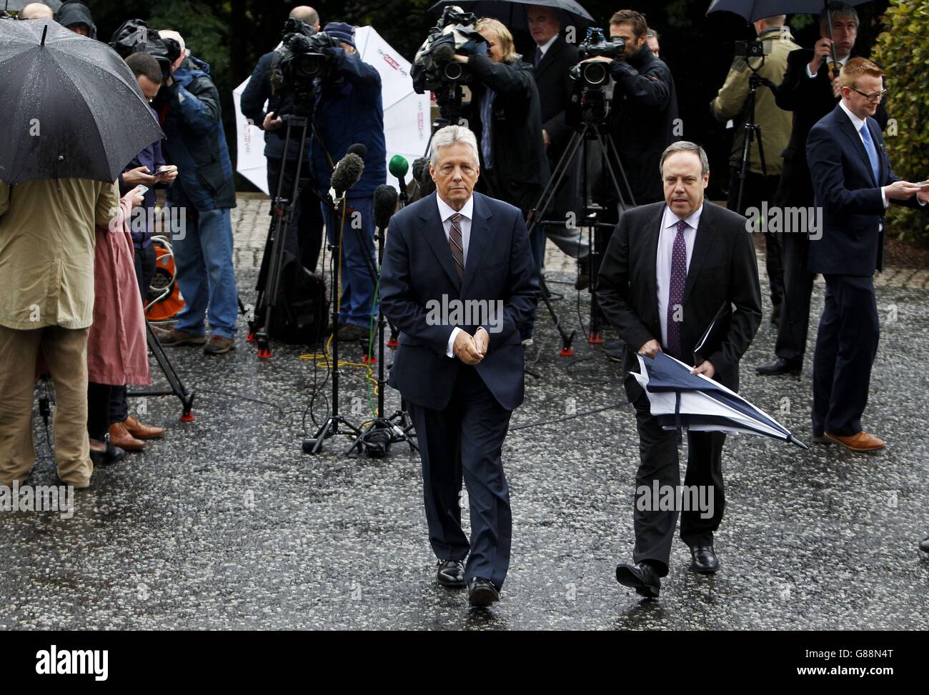 DUP leader Peter Robinson (left) and Nigel Dodds after speaking to the media at Stormont Castle in Belfast. Stock Photo