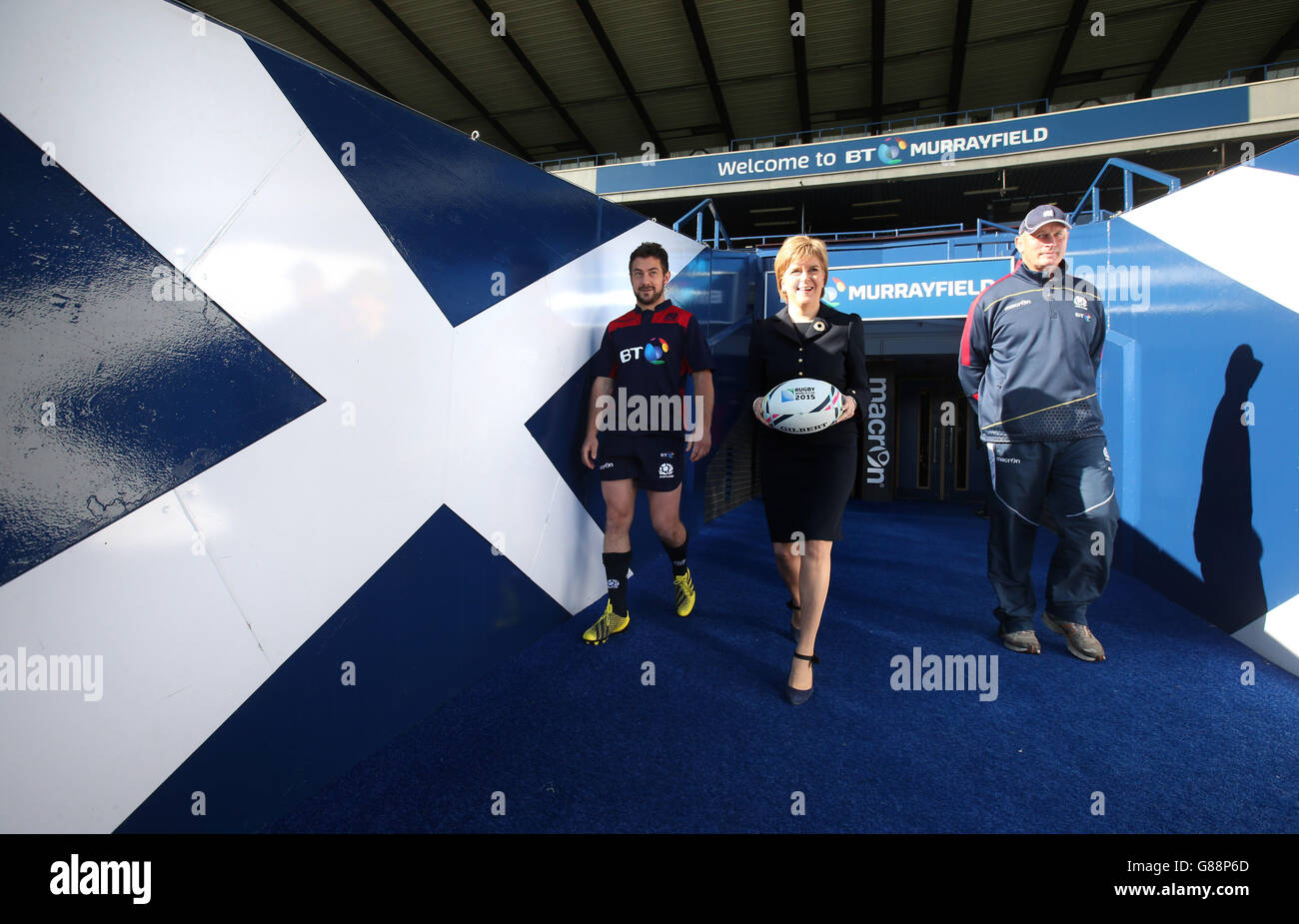 First Minister Nicola Sturgeon Walks From The Tunnel With Captain Greig Laidlaw Left And Coach Vern Cotter As She Meets The Scotland Rugby World Cup Squad At Murrayfield Stadium Ahead Of The