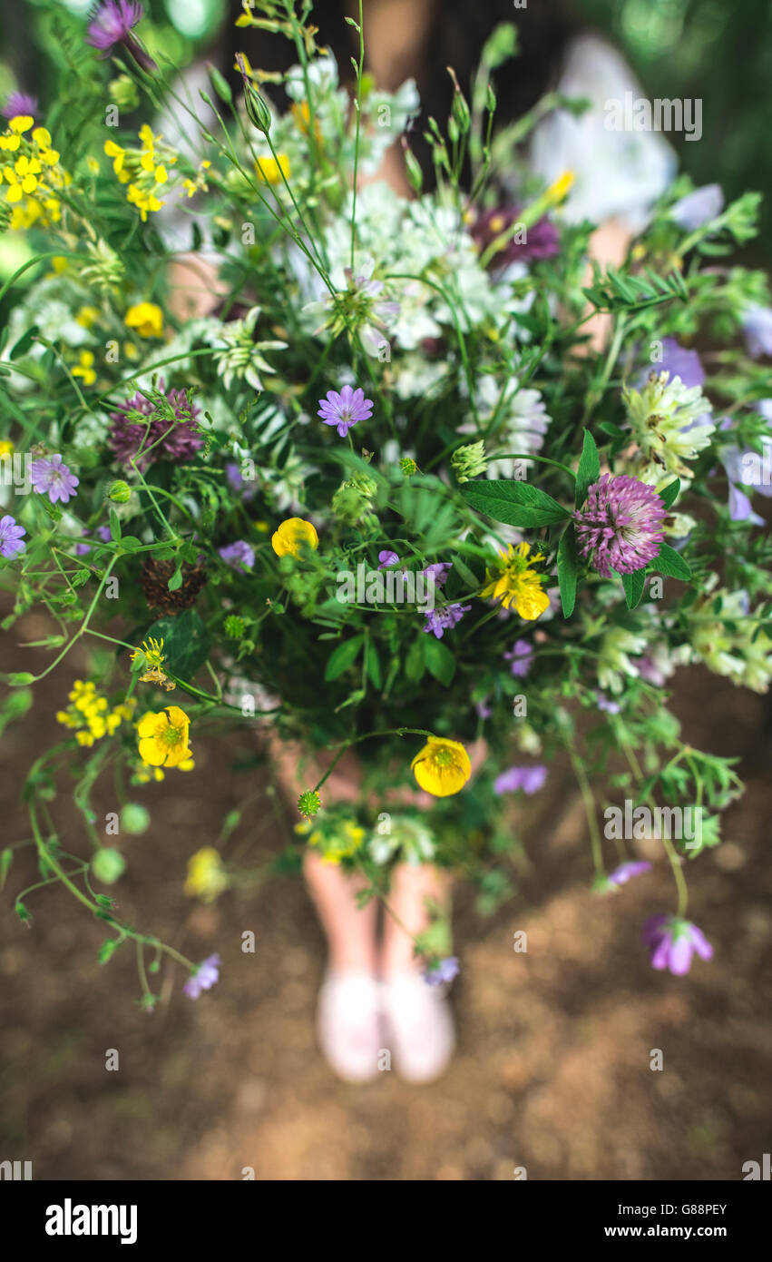 Woman hold bouquet of wildflowers Stock Photo