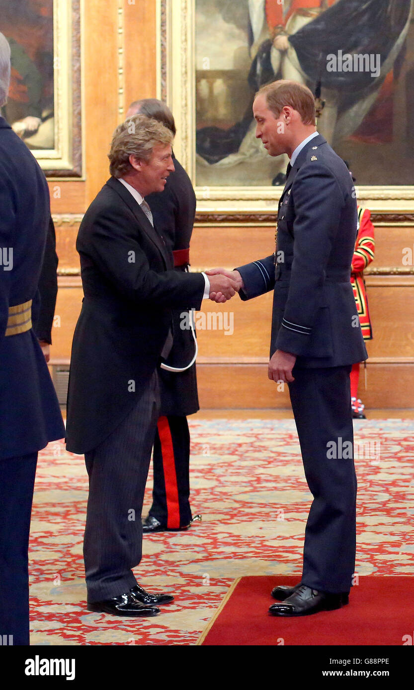 Nigel Lythgoe, from West Berkshire, is made an OBE (Officer of the Order of the British Empire) by the Duke of Cambridge during an investiture ceremony at Windsor Castle. Stock Photo