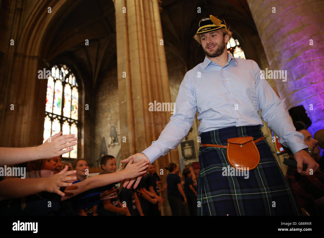 Rugby Union - Scotland Welcome Ceremony - Gloucester Cathedral. Scotland's Richie Gray greets school children during the welcome ceremony at Gloucester Cathedral. Stock Photo