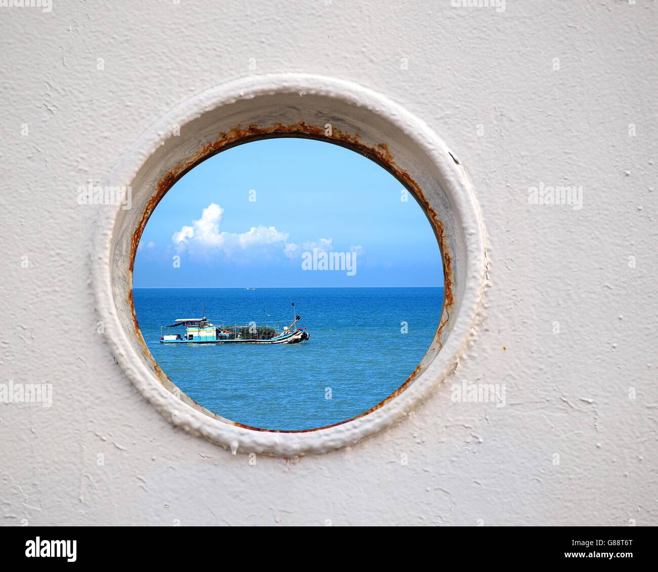 Porthole view of a Chinese fishing boat on the East China Sea Stock